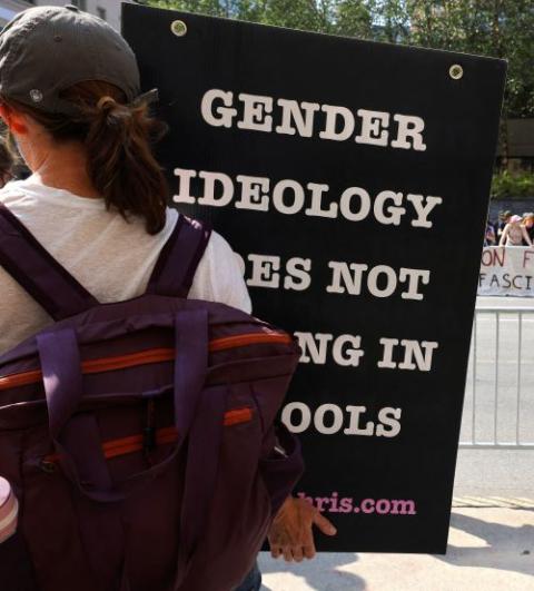 A person protesting medical treatments for youth who identify as transgender stands across the street from counterprotesters outside Children's Hospital in Boston Sept. 18, 2022. Surgery and medical intervention to change a person's "sex characteristics" to those of opposite sex "are not morally justified," the U.S. bishops' doctrine committee said in a 14-page statement issued March 20, 2023. (OSV News/Reuters/Brian Snyder)